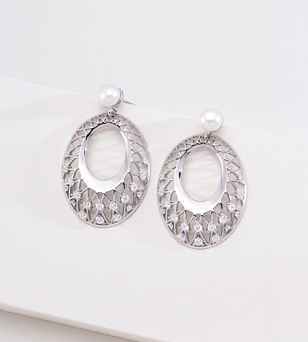 18K gold-plated S925 silver oval drop earrings with openwork lattice, cubic zirconia accents and freshwater pearl tops.