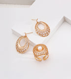 18K gold-plated 925 silver vintage gold oval lace drop earrings with freshwater pearls and cubic zirconia, displayed beside an openwork pearl ring.