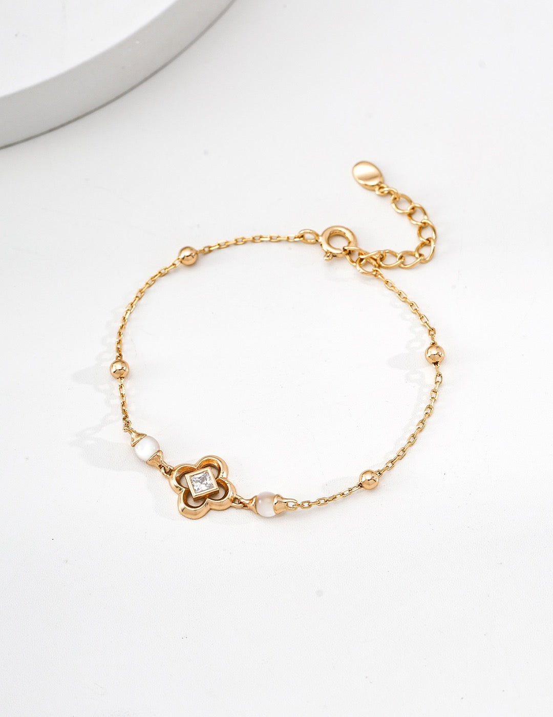 18K gold-plated S925 silver clover bracelet with square cubic zirconia, white shell beads, ball accents and an extender chain