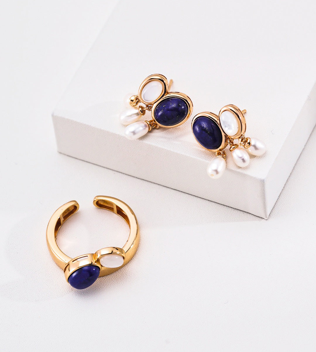 Gold-Plated jewelry set featuring an open ring and matching drop earrings, each with an oval lapis lazuli stone, mother-of-pearl, and three small white natural freshwater pearl drops, 18K Gold-Plated on S925 Sterling Silver | BUCKLE Collective