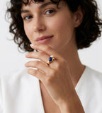 A close-up lifestyle shot of a woman wearing an 18K Gold-Plated S925 Silver Open Ring with Lapis Lazuli and Mother-of-Pearl | BUCKLE Collective
