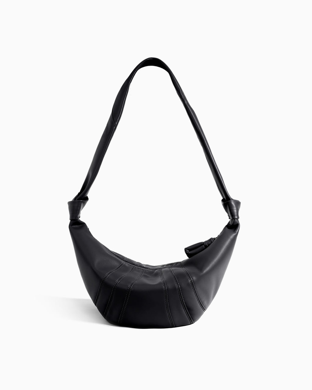 A black crescent-shaped shoulder bag with a single strap, featuring a quilted texture and a zippered top closure by BUCKLE Collective