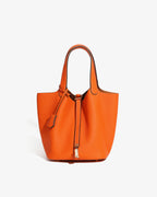 An Orange Large Genuine Togo Leather Bucket Bag with Gold-toned Lock and Inner Pouch