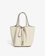 An off-white Large Genuine Togo Leather Bucket Bag with a gold-toned hardware and Inner Pouch