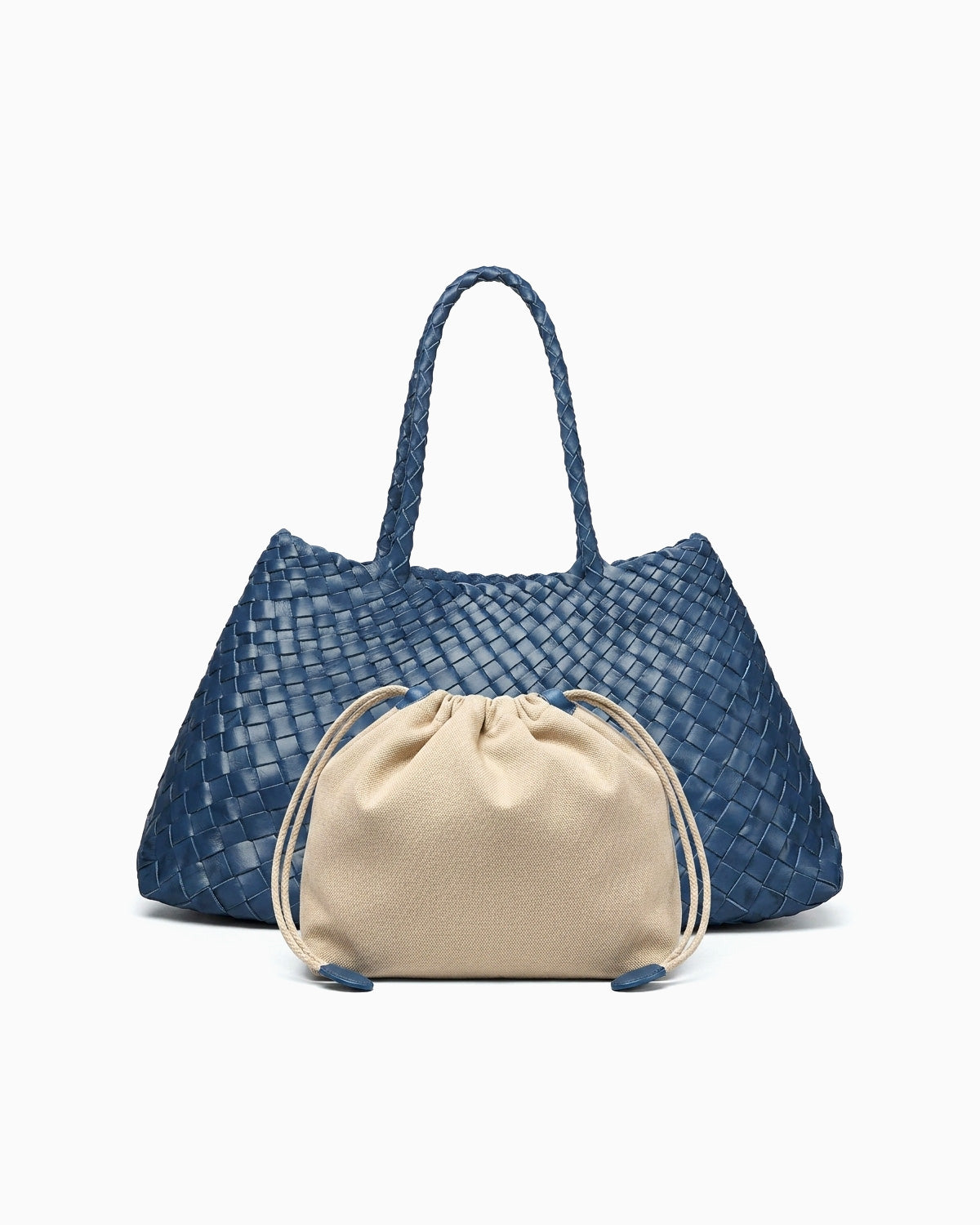 A blue woven leather tote bag with two top handles, shown with a beige drawstring pouch placed in front