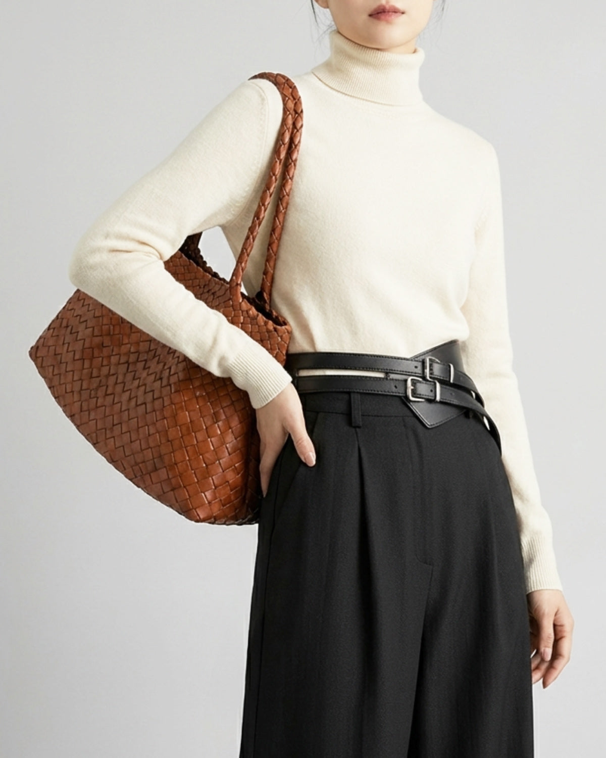 Woman in a stylish casual outfit with Handwoven Genuine Leather Shopper Tote Bag with Removable Pouch in Camel Color