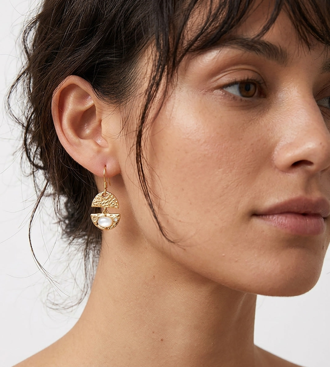 A close-up of a woman's ear and side profile wearing a Layered Seashell Mother-of-Pearl Dangle Earrings, 18K Gold-Plated S925 Silver | BUCKLE Collective