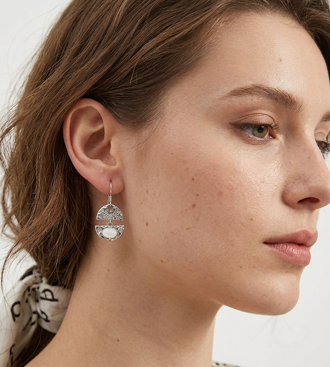 A close-up side profile of a woman wearing a delicate Layered Seashell Mother-of-Pearl Dangle Earrings, 18K White-Gold-Plated S925 Silver | BUCKLE Collective