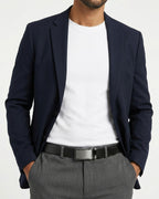 Man in a stylish smart-casual outfit wearing a Genuine Leather Ratchet Belt with Metallic Buckle | BUCKLE Collective