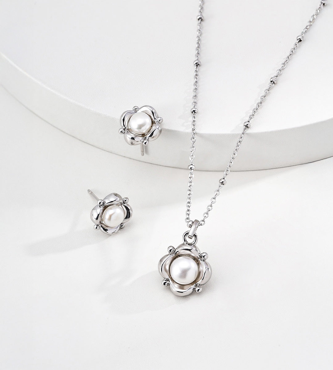 Flower natural pearl pendant necklace in silver-tone styled with matching floral pearl stud earrings — sculpted floral frame, 6mm natural pearl, beaded satellite chain, 18K white gold plated S925 silver, BUCKLE Collective