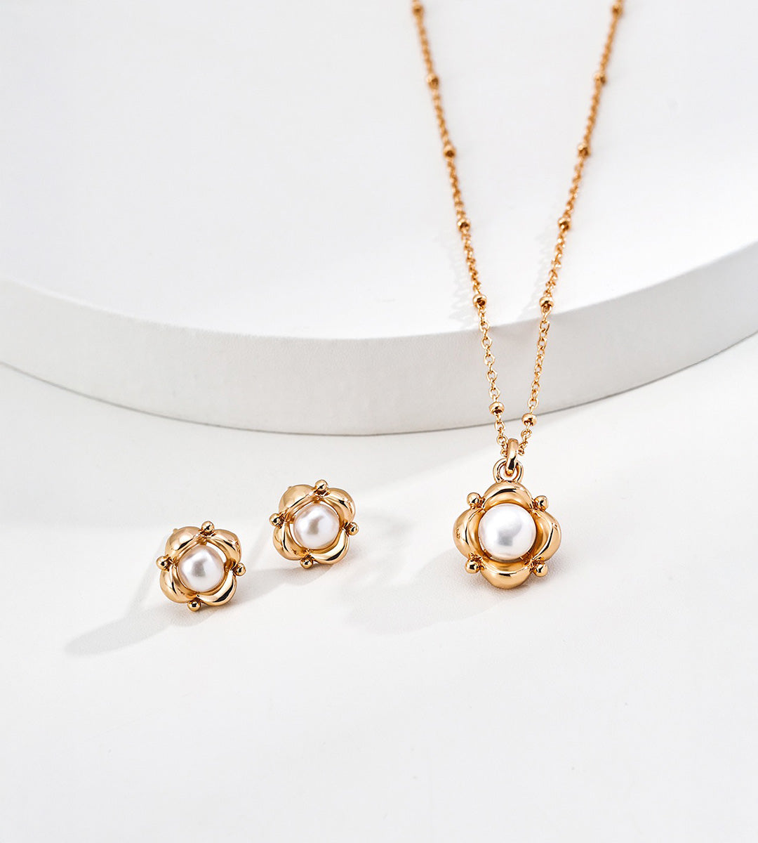 Flower natural pearl pendant necklace in vintage gold styled with matching floral pearl stud earrings — sculpted floral frame, 6mm natural pearl, beaded satellite chain, 18K gold plated S925 silver, BUCKLE Collective

