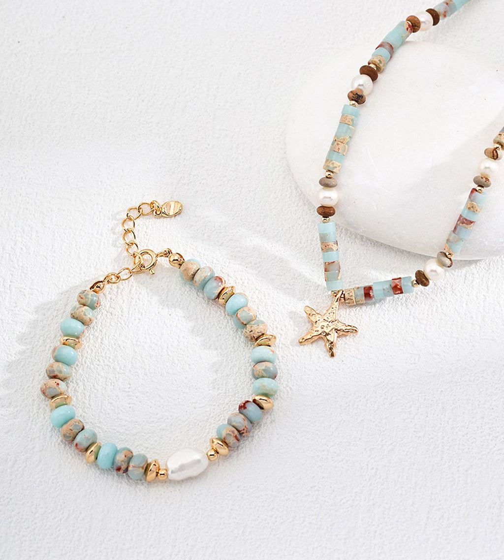Natural Pearl Shoushan stone bracelet flatlay with matching starfish charm necklace — lobster clasp and 3cm gold extender detail, sky-blue stone beads and freshwater pearl, 18K gold plated S925 silver, BUCKLE Collective