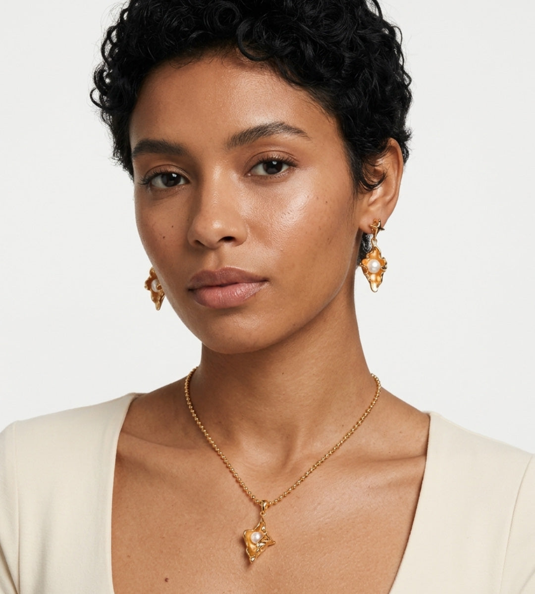 Model wearing Ocean’s Whisper Conch Pearl Earrings and Necklace, 18K Gold-Plated over S925 Sterling Silver