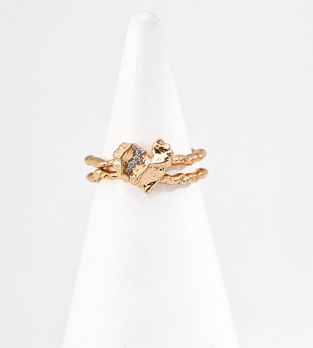 Textured heart open cuff ring front view on ring display — sculptural rock-textured heart with pavé CZ on double twisted adjustable band, 18K gold plated S925 sterling silver, vintage gold, BUCKLE Collective