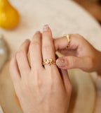 Rough texture heart open ring worn on hand in vintage gold — rock-textured heart with CZ inlay on double twisted open band, styled for everyday wear, 18K gold plated S925 sterling silver, BUCKLE Collective