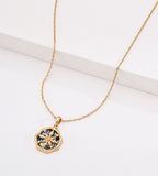 Abalone shell star compass necklace in 18K vintage gold plating — eight-pointed star compass pendant with iridescent abalone shell inlay, wavy octagonal border, adjustable chain, 18K gold plated S925 silver, BUCKLE Collective