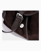 Buckle detail of a  Women's Suede Leather Backpack | BUCKLE Collective