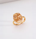 Sunny Daisy embossed open ring in vintage gold — 3D raised daisy blooms with engraved "sunny" lettering and pavé cubic zirconia accents on oval signet plaque, 18K gold plated S925 sterling silver, BUCKLE Collective