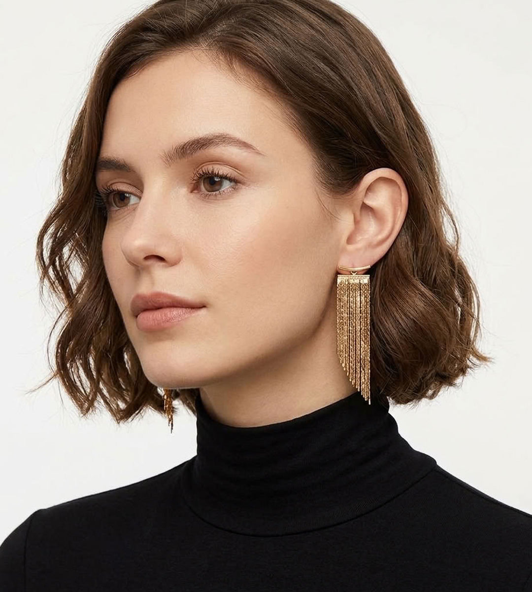A woman wearing 18K Gold-Plated S925 Silver T-Bar Long Chain Tassel Drop Earrings