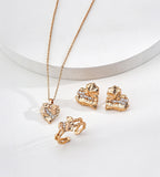 Textured rock heart stud earrings overhead view — irregular cracked gold surface with pavé cubic zirconia stones, 18K gold plated S925 sterling silver, vintage gold, BUCKLE Collective

