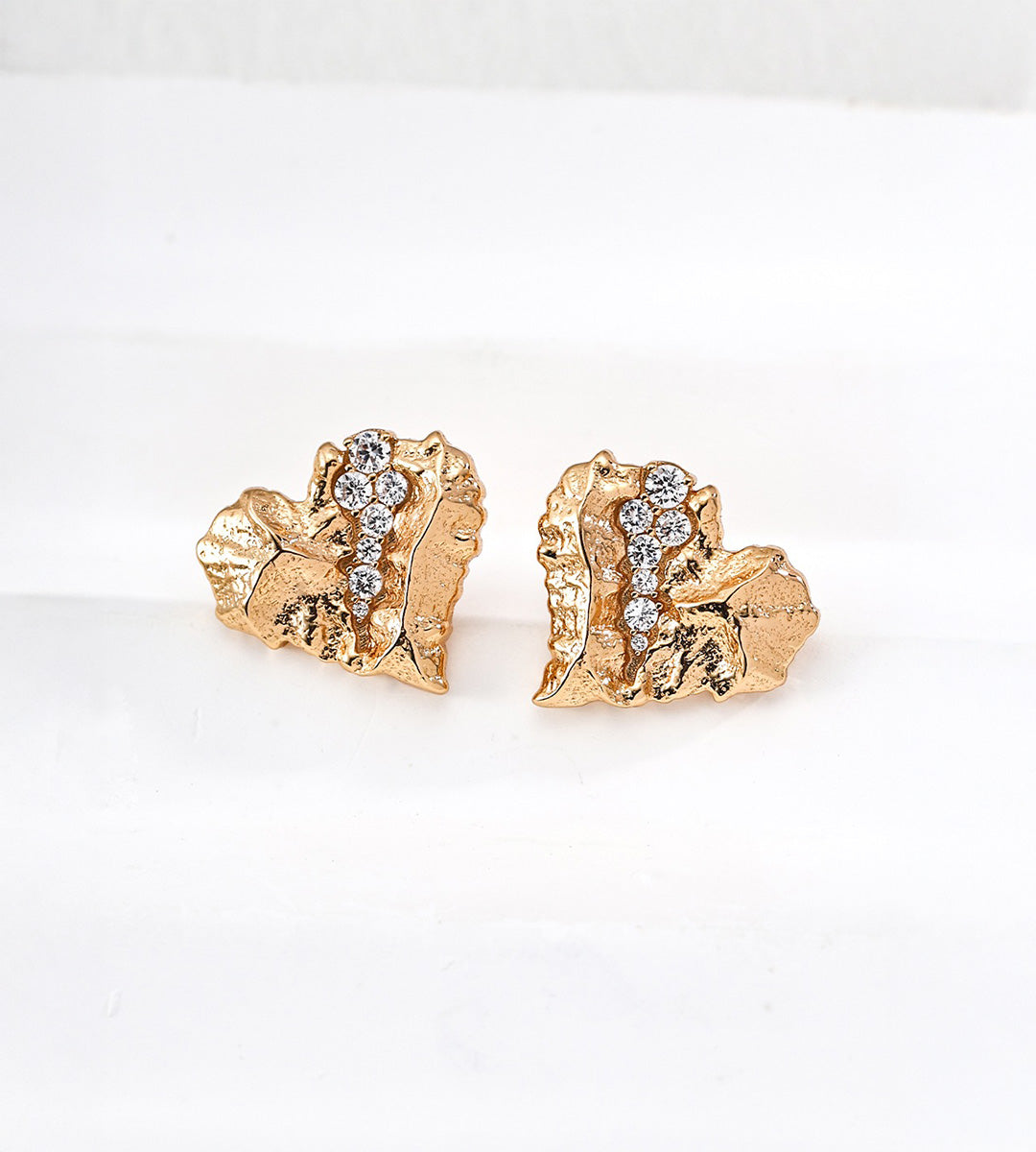 Textured heart stud earrings in vintage gold — sculptural rock-textured irregular heart with pavé CZ crystal vein detail, 18K gold plated S925 sterling silver, approx. 1.8cm, BUCKLE Collective