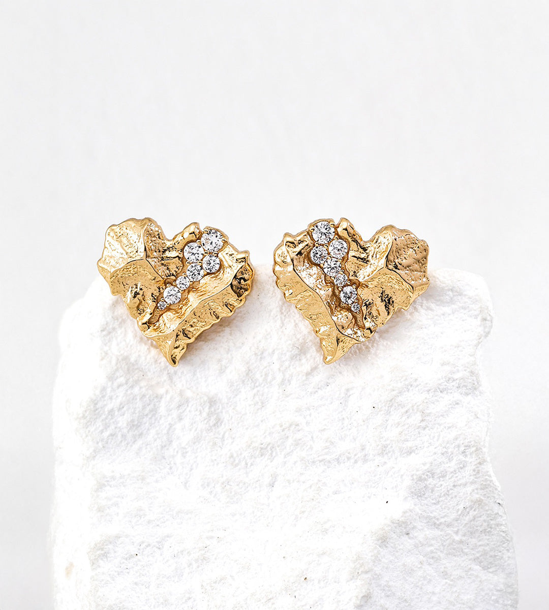 Textured rock heart stud earrings in vintage gold — irregular cracked surface with pavé cubic zirconia inlay, 18K gold plated S925 sterling silver, BUCKLE Collective