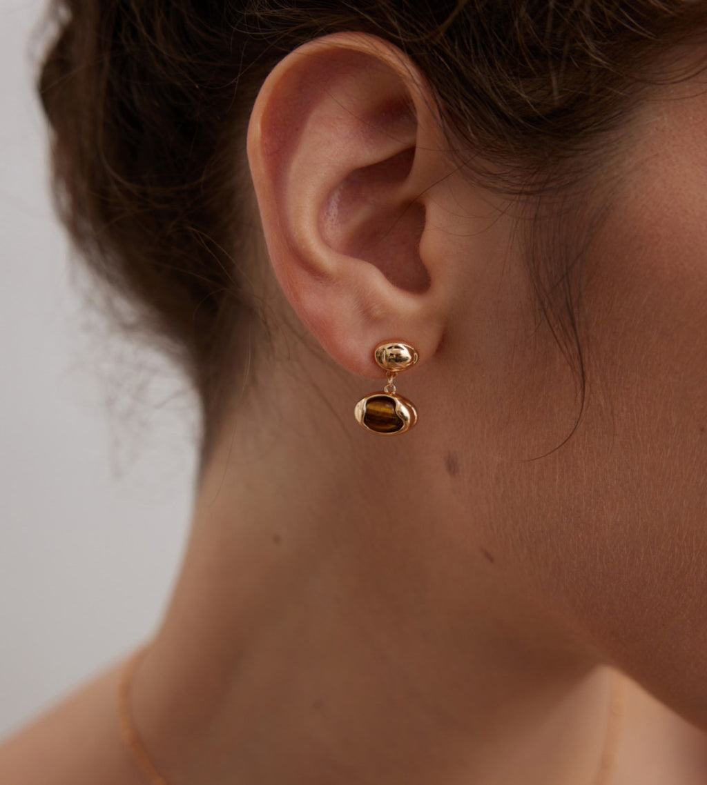 Model wearing The Solstice Tiger's Eye Inlay Drops 18K Gold-Plated on S925 Silver