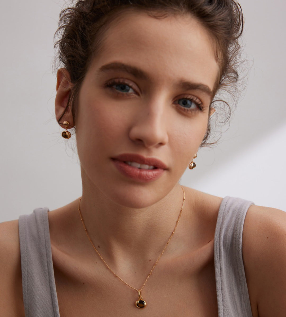 Model wearing The Solstice Tiger's Eye Inlay Drops with Necklace 18K Gold-Plated on S925 Silver