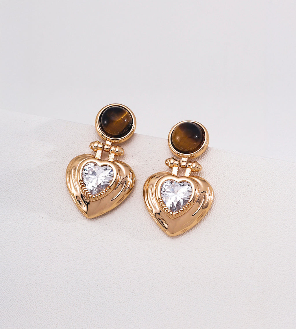 Tiger's eye and heart-cut cubic zirconia heart drop earrings in 18K gold plating — round tiger's eye cabochon stud with puffed gold heart pendant and sparkling CZ center stone, S925 silver, BUCKLE Collective