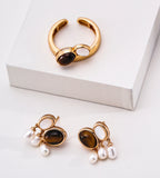Gold-toned jewelry set featuring an open ring and matching drop earrings, each with an oval tiger's eye stone, mother-of-pearl, and three small white natural freshwater pearl drops, 18K Gold-Plated on S925 Sterling Silver | BUCKLE Collective