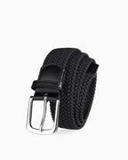 A black braided woven belt with a polished silver-tone metal buckle and black leather accents | BUCKLE Collective