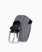 A gray braided woven belt with a black leather keeper and a silver-tone metal buckle | BUCKLE Collective