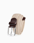 A woven beige belt with dark brown leather accents and a silver-tone metal buckle | BUCKLE Collective