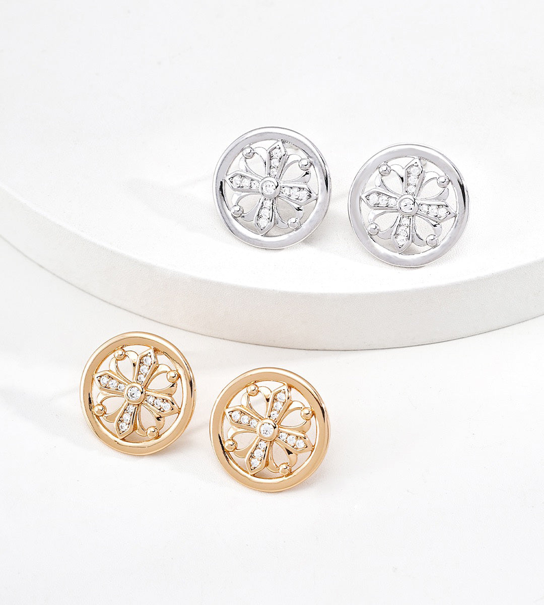 Two pairs of 18K gold-plated and 18K white-gold-plated Vintage Iris Cross Stud Earrings with a floral cutout design accented with Zircon