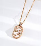 Mother-of-pearl landscape pendant necklace with gold-tone mountain and cloud details, cubic zirconia accents and a fine chain
