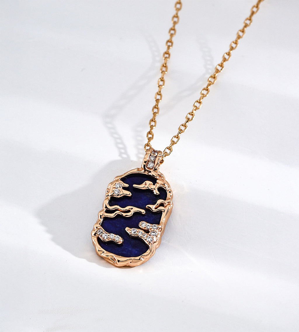 Lapis lazuli landscape pendant necklace with gold-tone mountain and cloud openwork, cubic zirconia accents and a fine chain