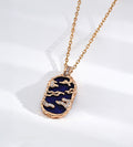 Lapis lazuli landscape pendant necklace with gold-tone mountain and cloud openwork, cubic zirconia accents and a fine chain