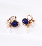 A pair of 18K gold-plated on S925 silver drop earrings featuring oval-shaped lapis lazuli and mother-of-pearl, with dangling white natural freshwater pearls