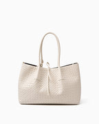 A white woven leather large tote bag with double top handles and a drawstring detail