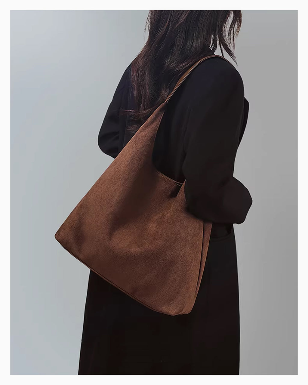 A woman in a black coat wearing a Brown Suede Tote Bag with Vegan Faux leather single strap