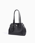 Side view of the Elegant Genuine Leather Black Bucket Tote Bag with Spacious Interior and Detachable Leather Lipstick Pouch