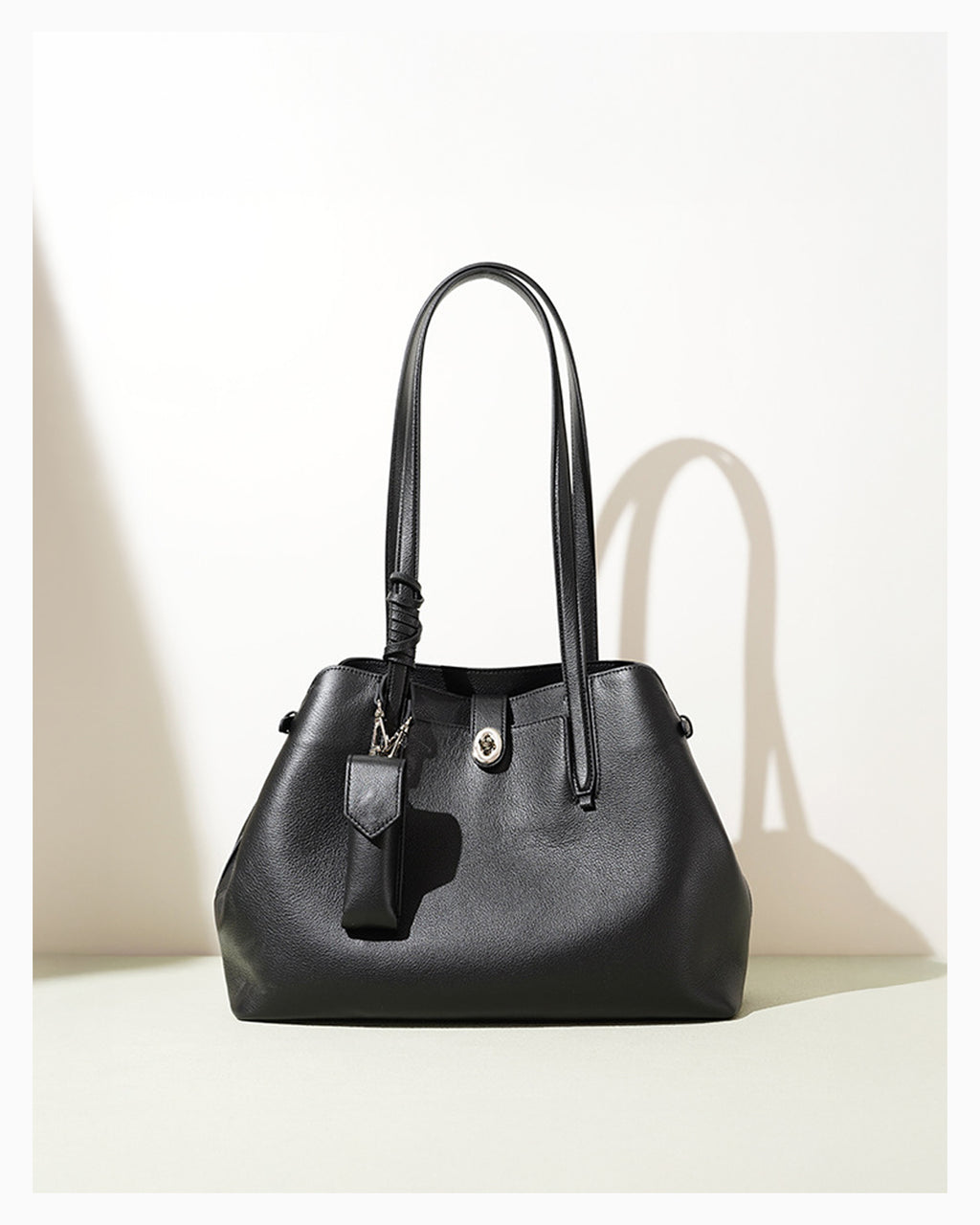 Women's Elegant Genuine Leather Black Tote Bucket Bag with Spacious Interior and Detachable Leather Lipstick Pouch