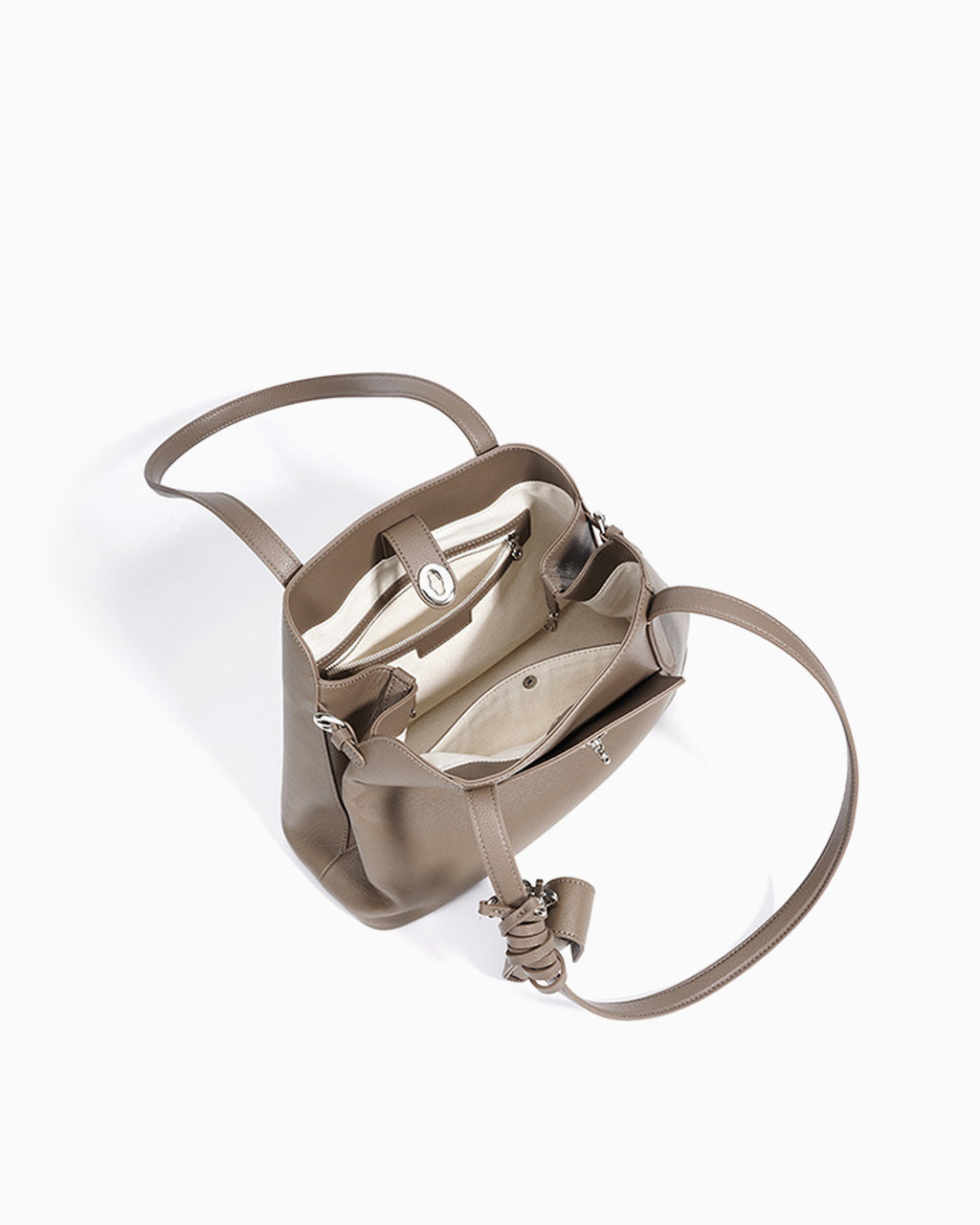 Interior details of the Women's Elegant Genuine Leather Beige Gray Tote Bucket Bag with Spacious Interior and Detachable Leather Lipstick Pouch