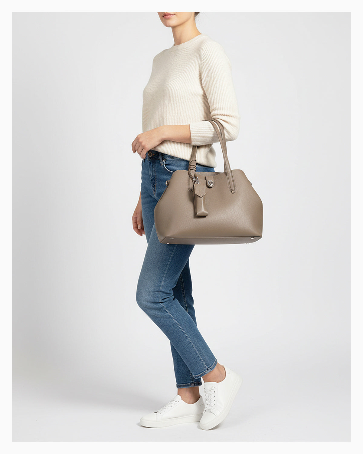 A woman in a casual outfit with a Genuine Leather  Beige Grey Tote Bag with Spacious Interior and Detachable Leather Lipstick Pouch