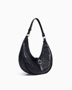 Side View on the Genuine Top-Grain Cowhide Leather Dumpling Bag with Adjustable Strap & Buckle Accent, Black color