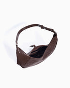 Compartment detail on the Genuine Top-Grain Cowhide Leather Dumpling Bag with Adjustable Strap & Buckle Accent, Coffee color