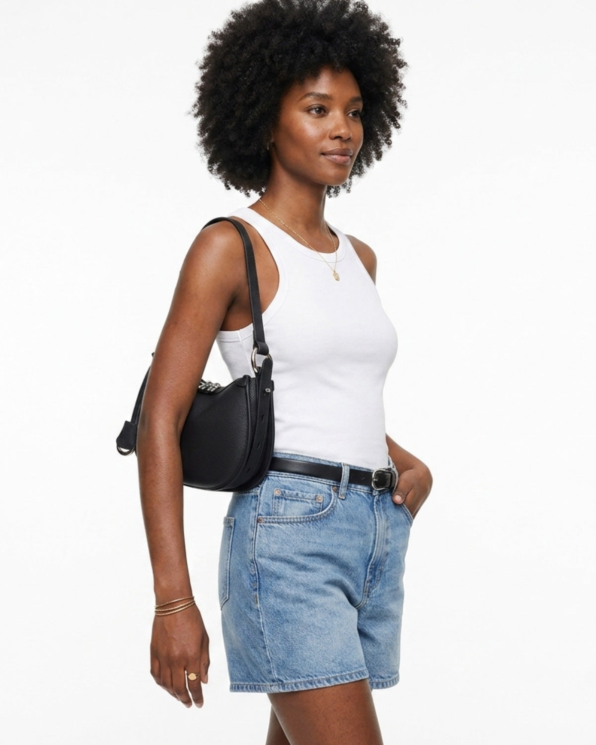 A woman in a casual summer outfit with a Black Genuine Leather Crescent Shoulder Bag with Adjustable Strap