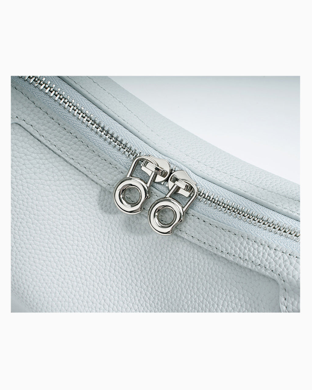 Hardware details, zipper, and stitching of the Genuine Leather Crescent Shoulder Bag with Adjustable Strap