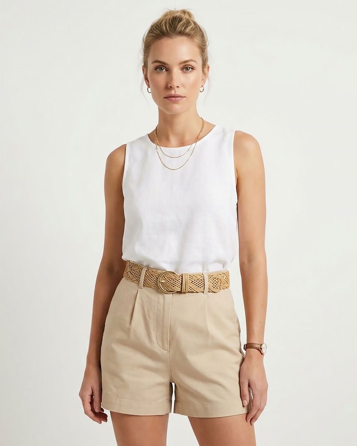 Woman in a stylish summer outfit wearing a woven tapioca yellow belt with a gold-tone metal buckle | BUCKLE Collective