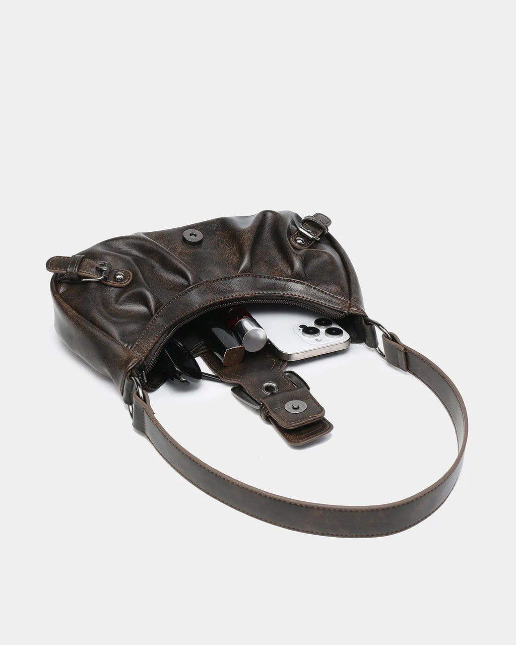 What fits inside the Women's Y2K Vegan Leather Shoulder Coffee color Bag with Buckle Detail